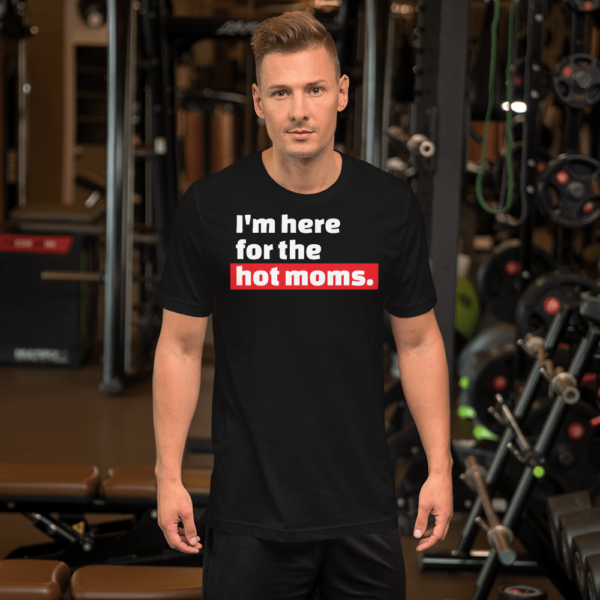 man in I'm here for the hot moms tshirt black with white text