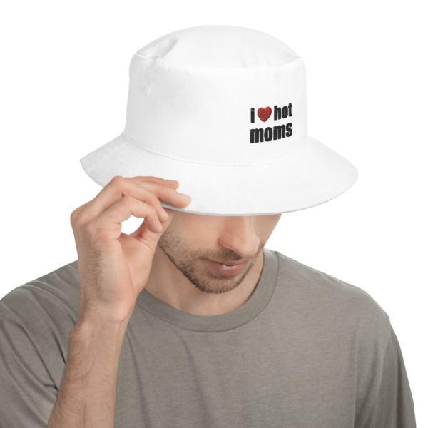 man in i love hot moms white bucket hat with red heart and black text